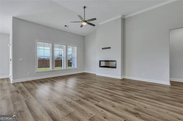 unfurnished living room featuring high vaulted ceiling, ceiling fan, crown molding, and hardwood / wood-style flooring