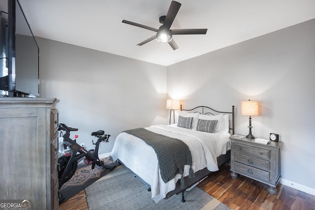 bedroom featuring dark hardwood / wood-style floors and ceiling fan