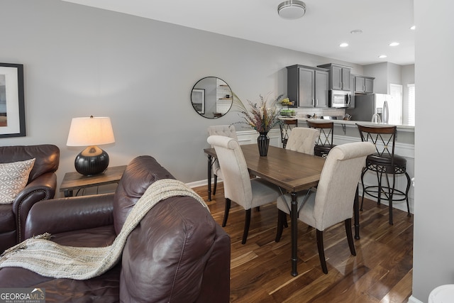 dining room with dark hardwood / wood-style floors