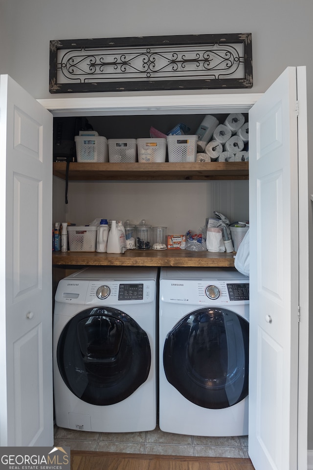 laundry area with independent washer and dryer