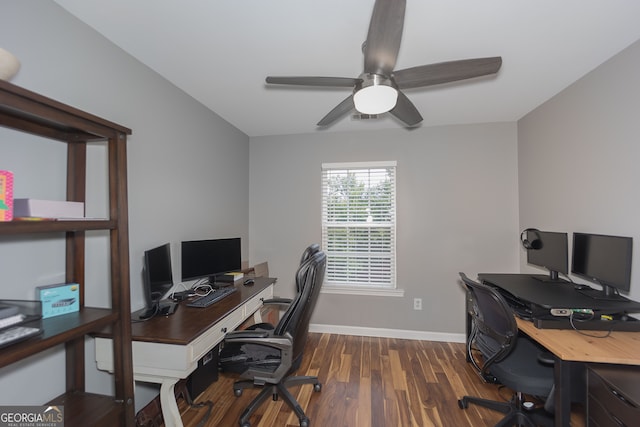 home office with ceiling fan and dark hardwood / wood-style floors