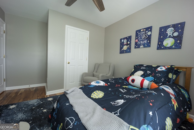 bedroom with ceiling fan and wood-type flooring