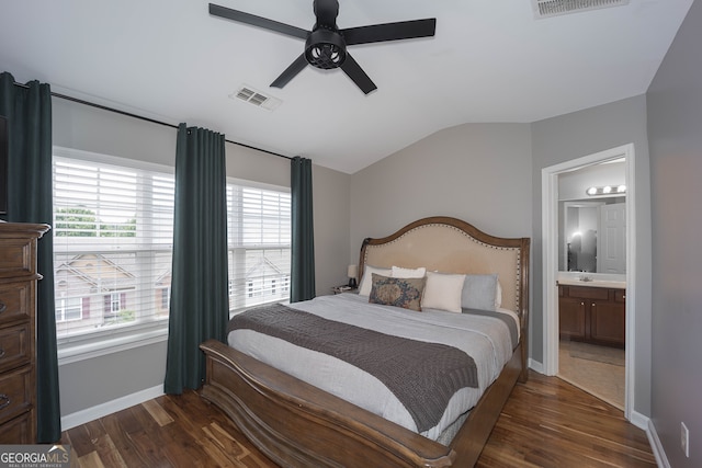 bedroom featuring vaulted ceiling, ensuite bath, ceiling fan, and dark hardwood / wood-style floors