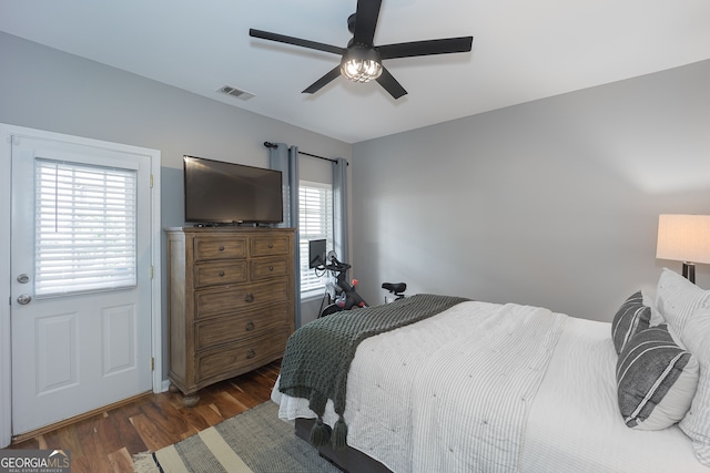 bedroom featuring dark hardwood / wood-style flooring and ceiling fan