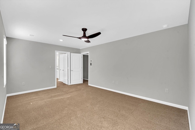 carpeted empty room with ceiling fan