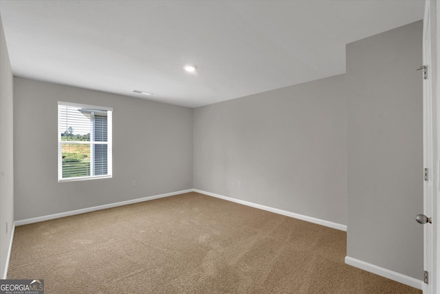 unfurnished room with carpet floors