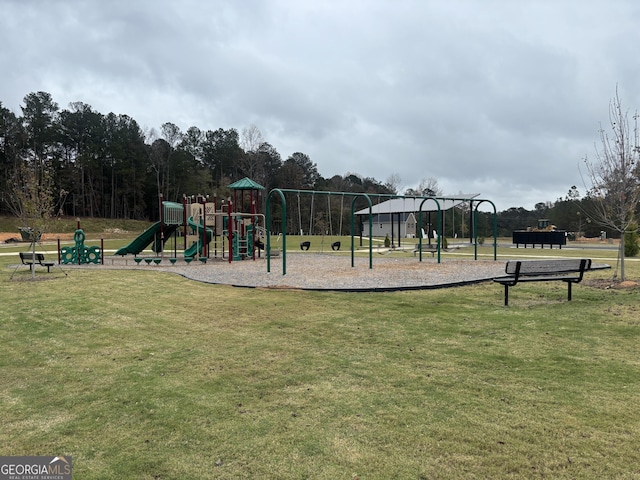 view of jungle gym with a lawn