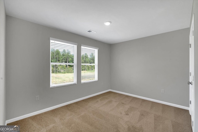 unfurnished room with carpet flooring