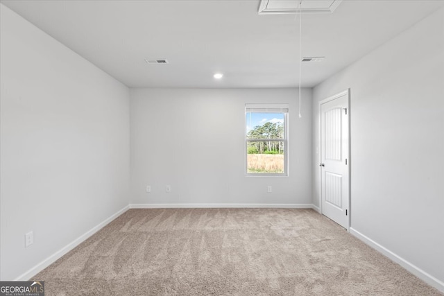 empty room with light colored carpet