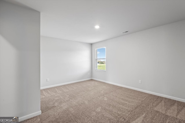 empty room featuring carpet flooring