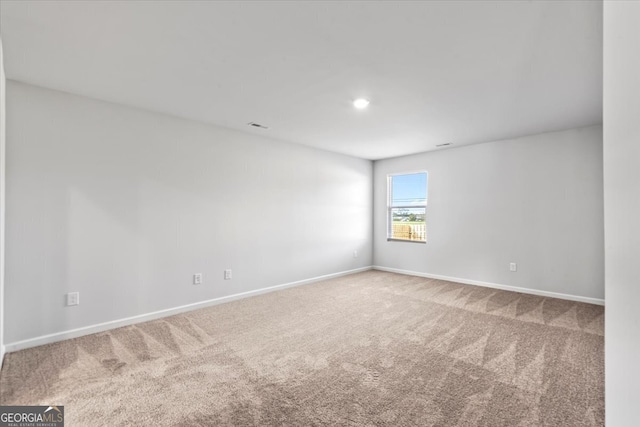 unfurnished room featuring carpet floors