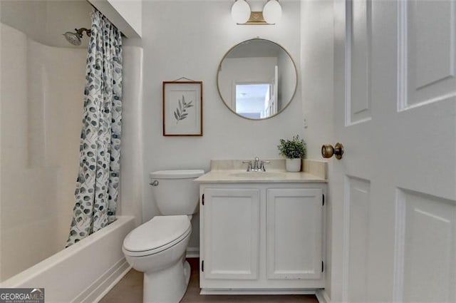 full bathroom with shower / tub combo, vanity, and toilet