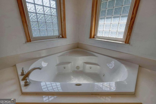 bathroom featuring a tub to relax in