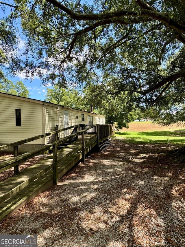 view of yard with a wooden deck