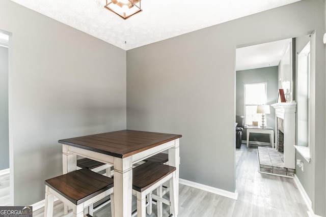 dining space featuring light wood-type flooring