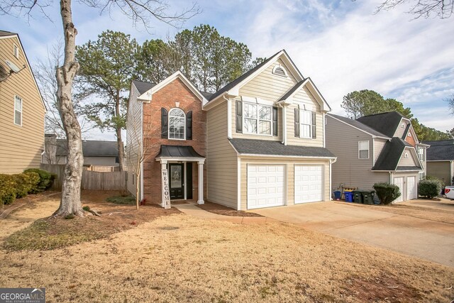 view of property featuring a garage, central AC, and a yard