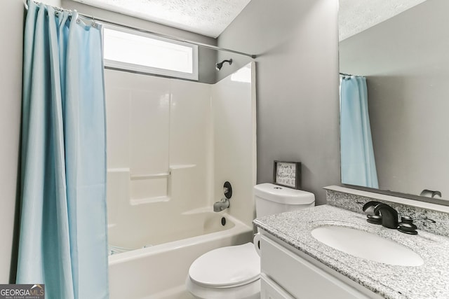 full bathroom featuring vanity, toilet, a textured ceiling, and shower / bath combo with shower curtain