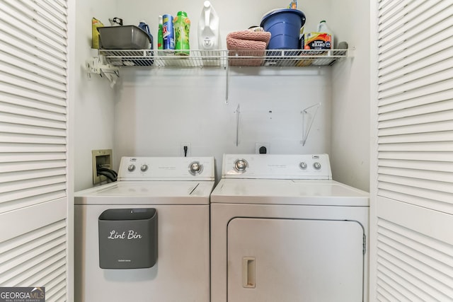 clothes washing area with washing machine and clothes dryer