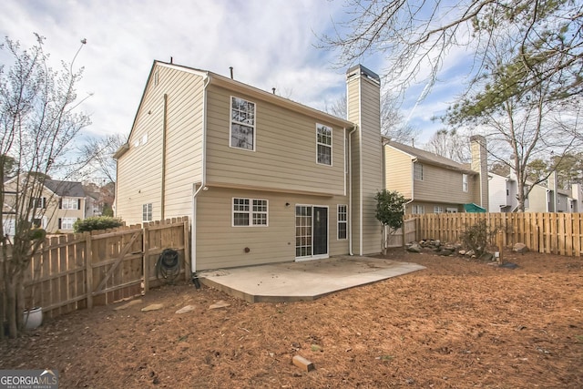 rear view of property featuring a patio