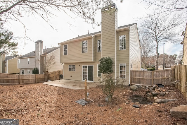 rear view of property with a patio area