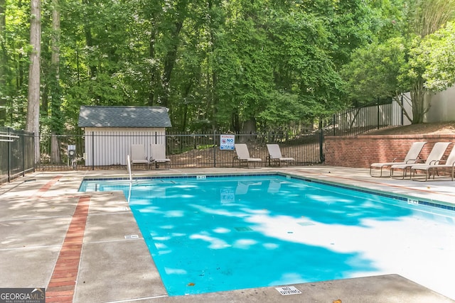 view of swimming pool with a patio