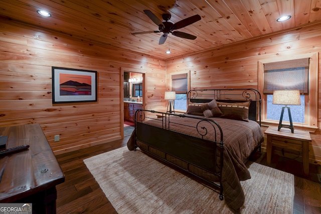 bedroom featuring ceiling fan, ensuite bath, hardwood / wood-style floors, and wood ceiling