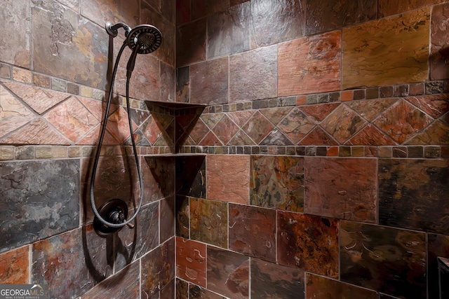 interior details with a tile shower