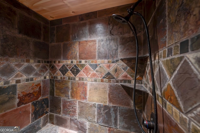 room details featuring a tile shower and wooden ceiling