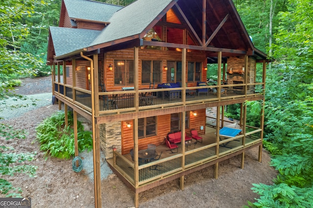 back of house featuring a deck