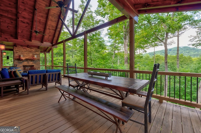 wooden deck featuring ceiling fan