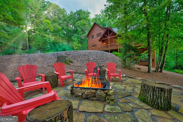 view of patio with a fire pit