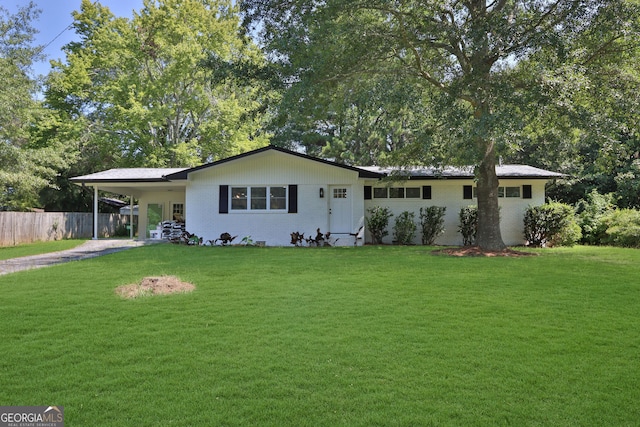 ranch-style home with a front lawn