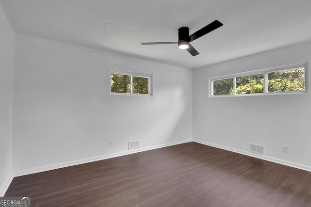 spare room with ceiling fan and hardwood / wood-style flooring