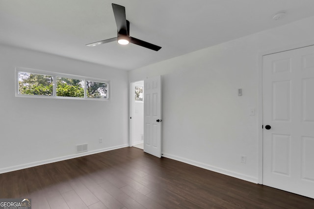 spare room with ceiling fan and wood-type flooring