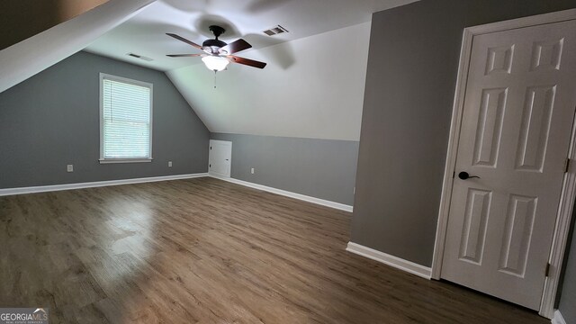 bonus room featuring ceiling fan, wood-type flooring, and vaulted ceiling