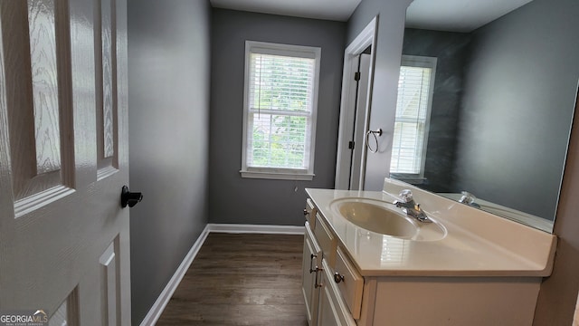 bathroom featuring vanity and hardwood / wood-style flooring