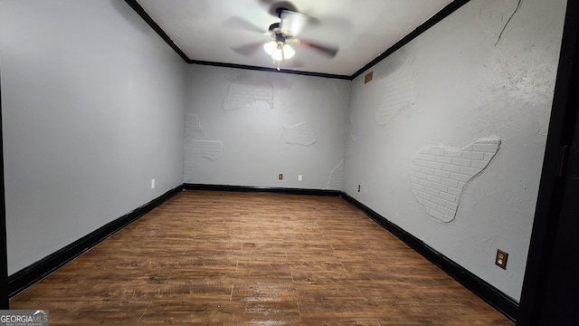 empty room with ceiling fan, wood-type flooring, and ornamental molding