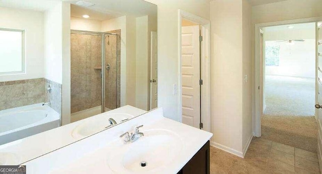 bathroom with vanity, plus walk in shower, and tile patterned flooring