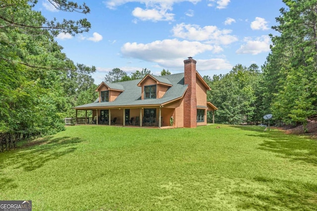 225 Big Oconee River Rd, Sparta, GA 31087 - rear view of house with a lawn and a chimney