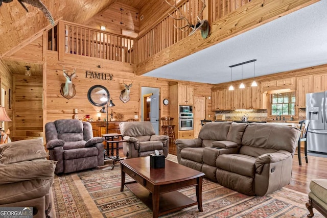 225 Big Oconee River Rd, Sparta, GA 31087 - living area featuring light wood-style floors and wood walls
