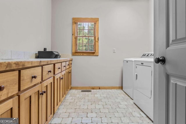 225 Big Oconee River Rd, Sparta, GA 31087 - laundry room featuring cabinet space, visible vents, baseboards, and separate washer and dryer