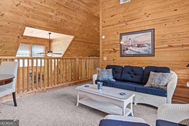225 Big Oconee River Rd, Sparta, GA 31087 - carpeted living room with ceiling fan, a towering ceiling, and wooden walls