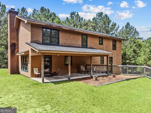 225 Big Oconee River Rd, Sparta, GA 31087 - back of house featuring a shingled roof, a chimney, a patio, and a yard