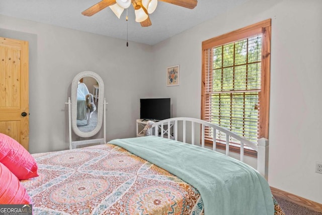 225 Big Oconee River Rd, Sparta, GA 31087 - carpeted bedroom featuring multiple windows and ceiling fan