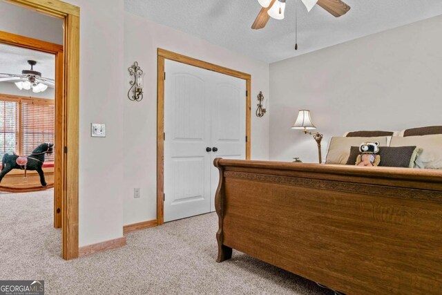 225 Big Oconee River Rd, Sparta, GA 31087 - bedroom featuring light carpet, ceiling fan, baseboards, and a textured ceiling