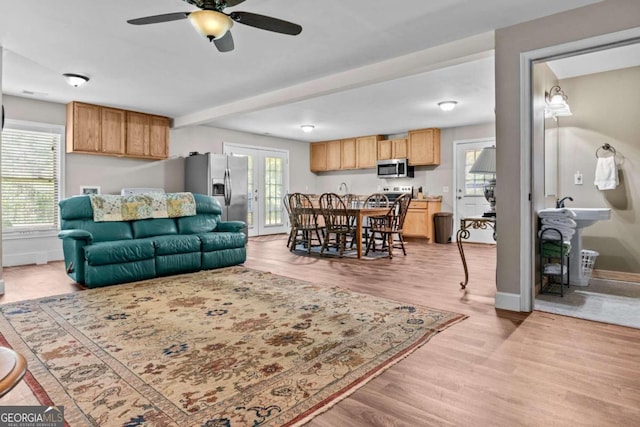 225 Big Oconee River Rd, Sparta, GA 31087 - living area featuring light wood finished floors, plenty of natural light, baseboards, and french doors