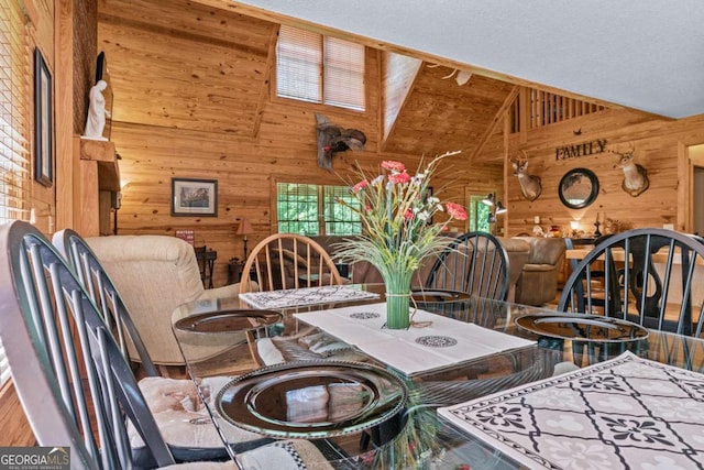 225 Big Oconee River Rd, Sparta, GA 31087 - dining room featuring wooden walls and high vaulted ceiling