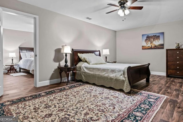 225 Big Oconee River Rd, Sparta, GA 31087 - bedroom featuring dark wood-type flooring, visible vents, ceiling fan, and baseboards