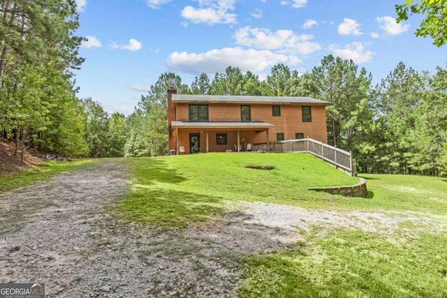 225 Big Oconee River Rd, Sparta, GA 31087 - view of front of property with a front lawn and a chimney