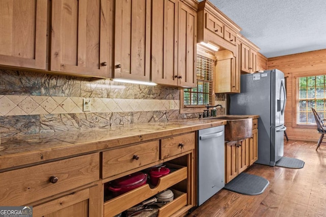 225 Big Oconee River Rd, Sparta, GA 31087 - kitchen featuring backsplash, dark wood-style flooring, stainless steel appliances, a textured ceiling, and a sink